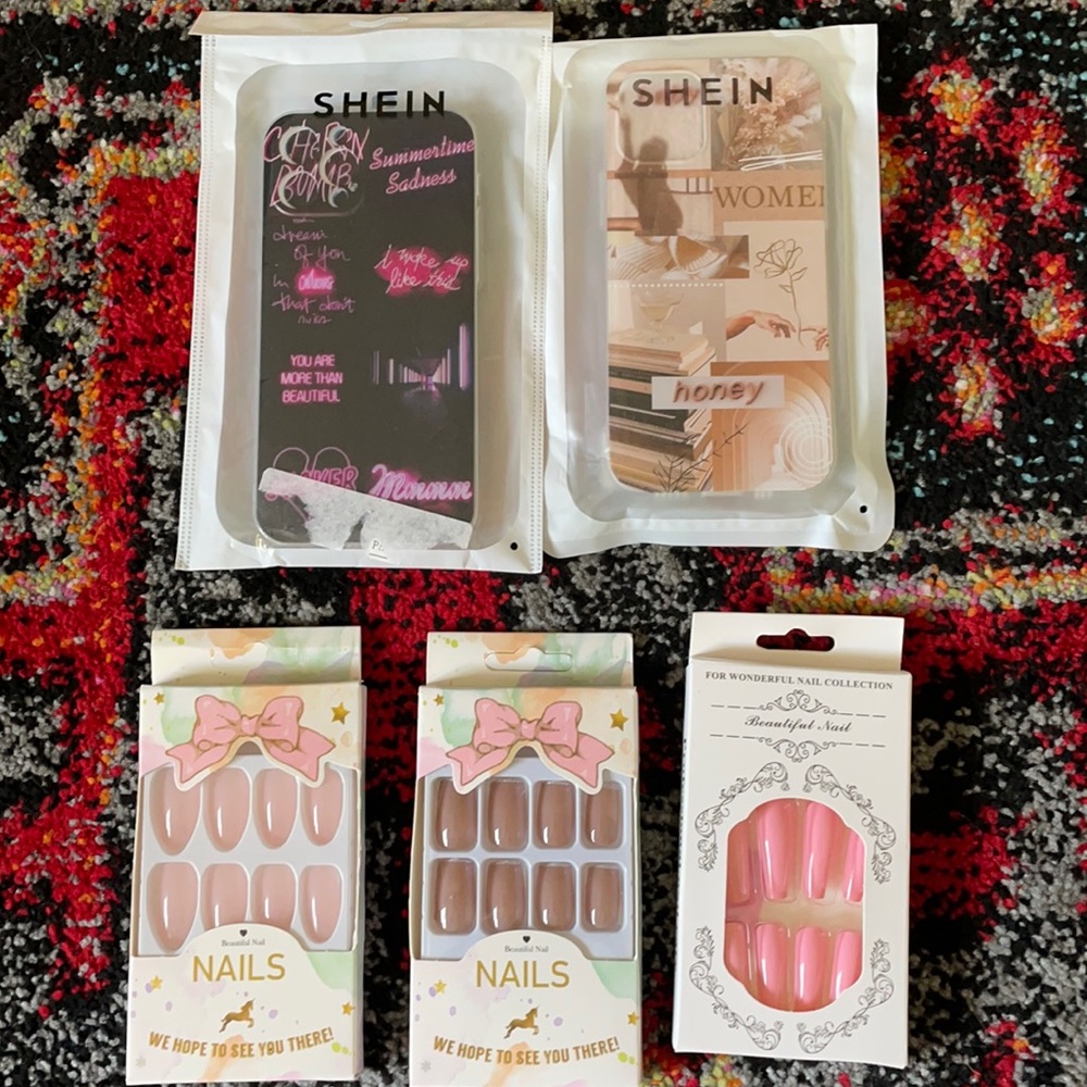 2 phone cases and 3 sets of acrylic nails